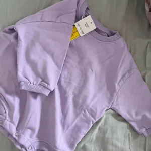 Modtaget Baby Cotton Long Sleeve Bubble Romper fra kunde U****i.