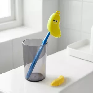 Bananformet tandbørste- og tandpasta-rejseetui til børn